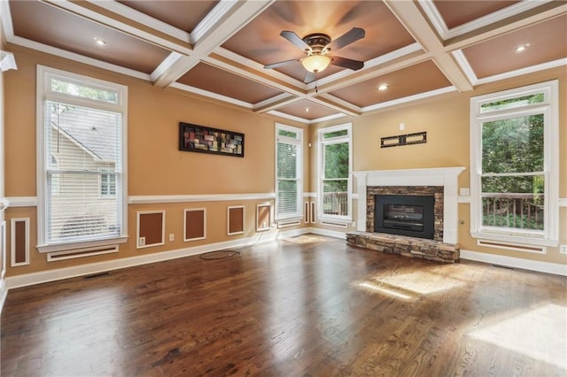 unfurnished living room with coffered ceiling, crown molding, and dark hardwood / wood-style floors