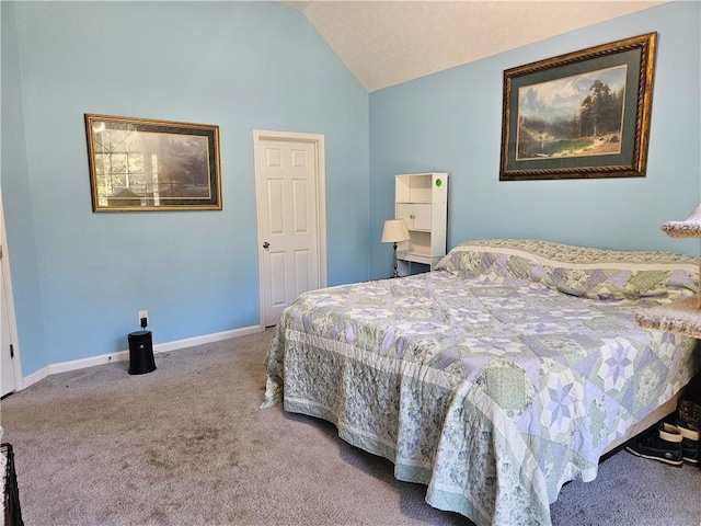 bedroom with lofted ceiling and carpet