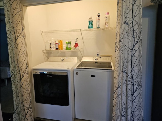 laundry area with separate washer and dryer