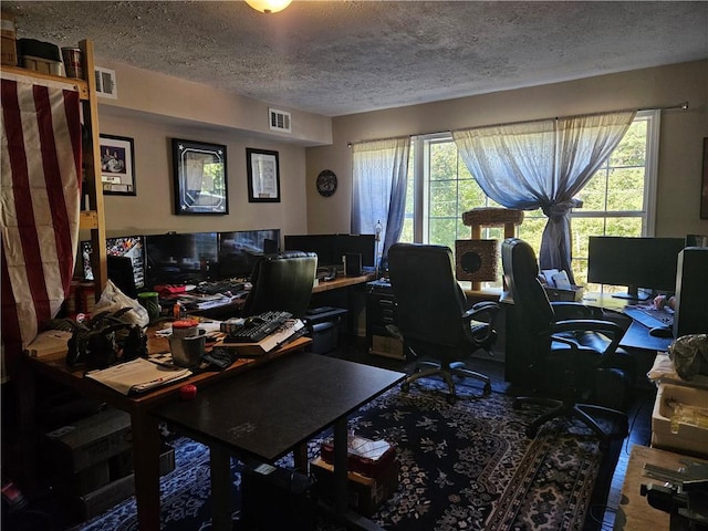 office area featuring a healthy amount of sunlight and a textured ceiling