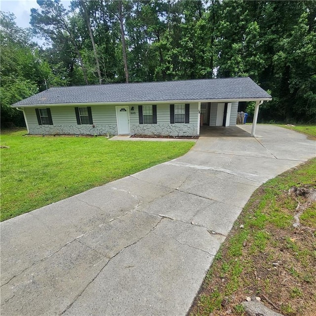3645 Shrewsbury Ct, Snellville, GA 30039 - single story home with driveway, stone siding, a front lawn, and a carport