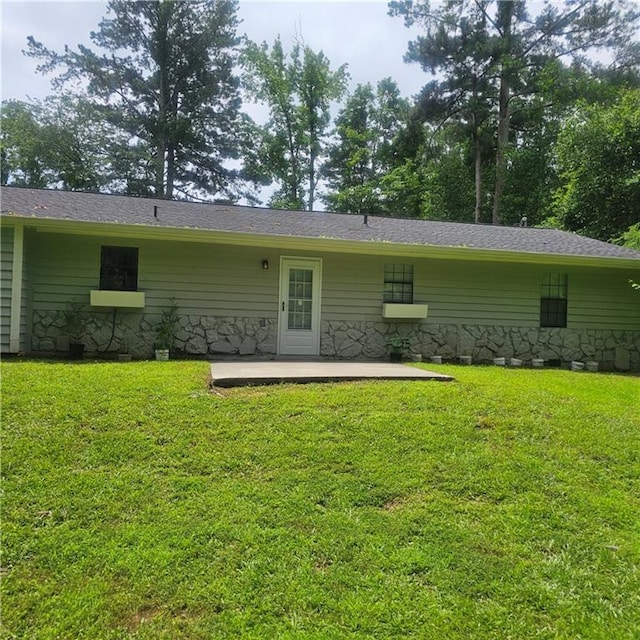 3645 Shrewsbury Ct, Snellville, GA 30039 - back of property featuring a patio area, a lawn, and stone siding