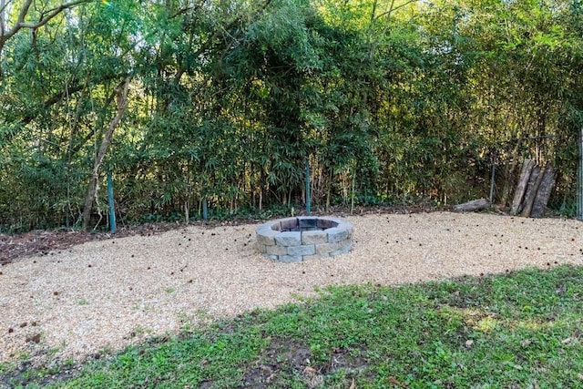 view of yard with a fire pit
