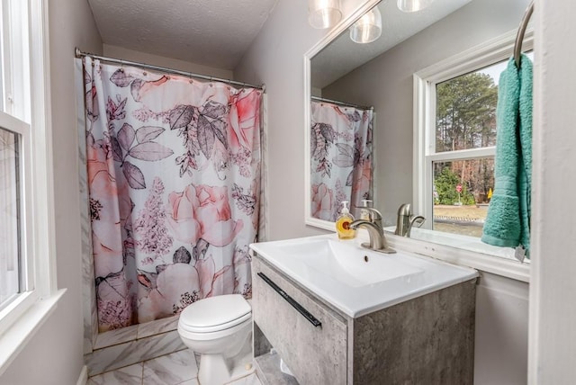 bathroom featuring a shower with curtain, toilet, a textured ceiling, and vanity