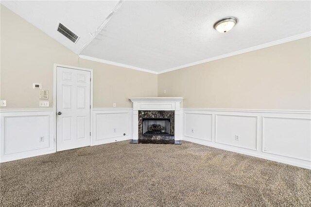 1212 Ashton Park Dr, Lawrenceville, GA 30045 - unfurnished living room featuring carpet, a wainscoted wall, a premium fireplace, crown molding, and a decorative wall