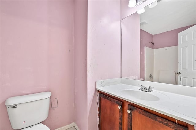 1212 Ashton Park Dr, Lawrenceville, GA 30045 - bathroom featuring toilet, vanity, and baseboards