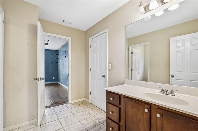 1212 Ashton Park Dr, Lawrenceville, GA 30045 - bathroom with vanity, marble finish flooring, and baseboards