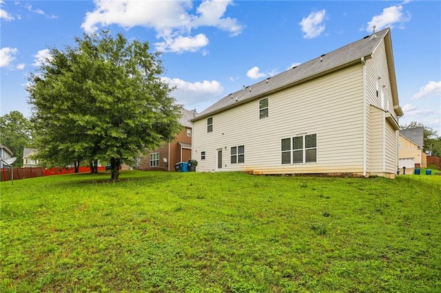 1212 Ashton Park Dr, Lawrenceville, GA 30045 - rear view of house featuring a yard