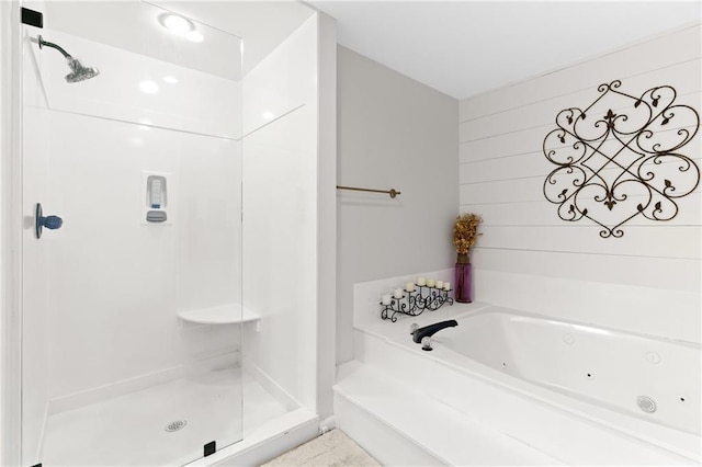 bathroom with independent shower and bath and wooden walls