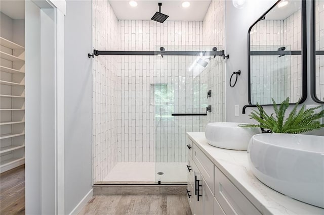 754 Fayetteville Rd SE, Atlanta, GA 30316 - full bath with a shower stall, wood finished floors, double vanity, and recessed lighting