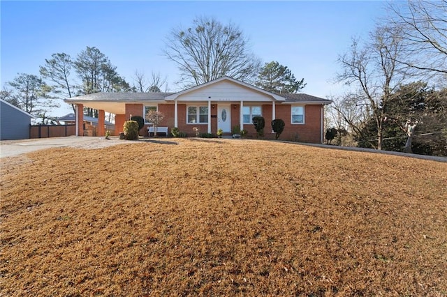 single story home with a carport and a front lawn