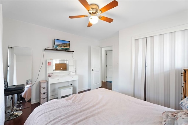 bedroom featuring dark hardwood / wood-style floors and ceiling fan