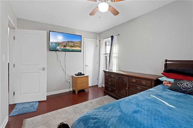 bedroom with dark wood-type flooring and ceiling fan