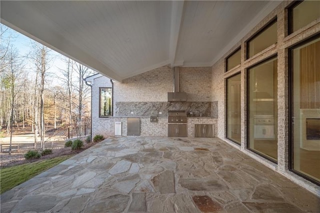 view of patio with a grill and exterior kitchen