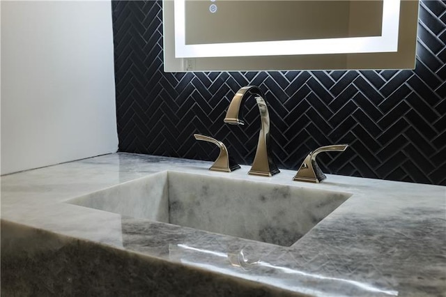 details with tasteful backsplash and a sink