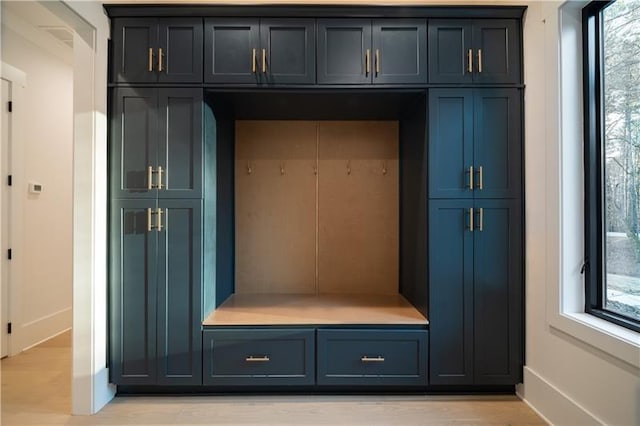 mudroom with baseboards and light wood-type flooring