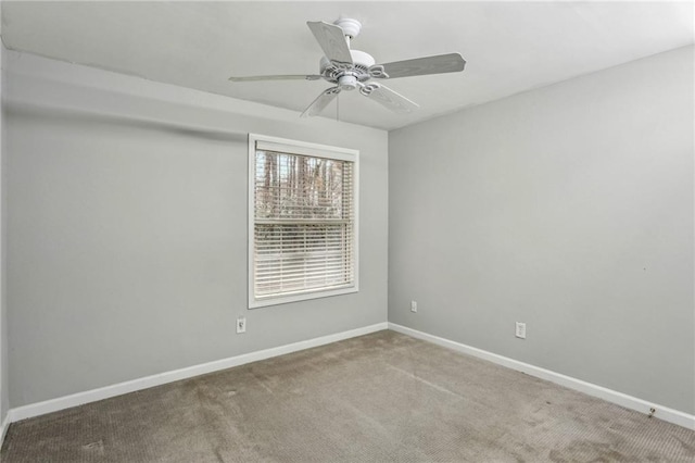 carpeted empty room with ceiling fan