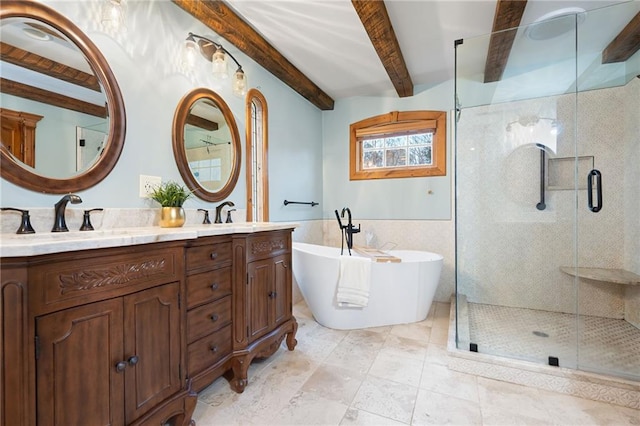 full bath featuring a shower stall, beamed ceiling, a soaking tub, and double vanity