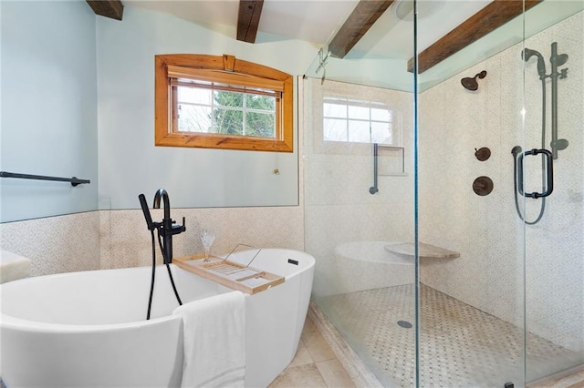 bathroom featuring a shower stall, a soaking tub, beam ceiling, tile walls, and tile patterned flooring