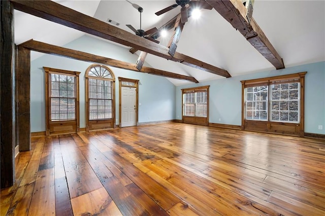 unfurnished living room with a ceiling fan, hardwood / wood-style floors, and baseboards