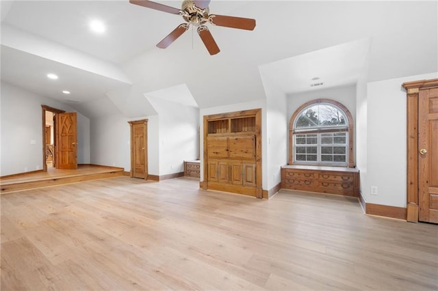 additional living space with lofted ceiling, light wood-style flooring, a ceiling fan, baseboards, and recessed lighting