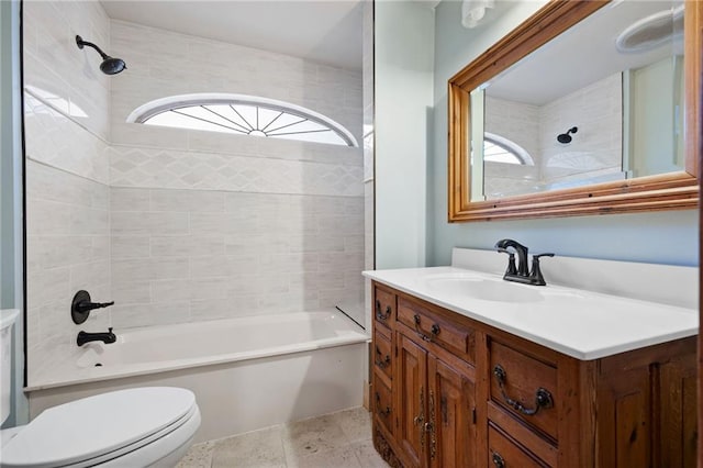 full bathroom featuring toilet, vanity, washtub / shower combination, and plenty of natural light