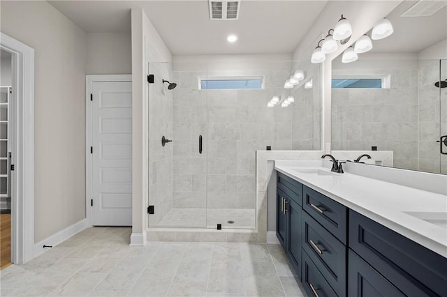 bathroom with vanity and walk in shower