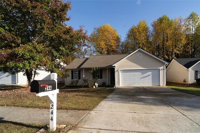 ranch-style home with a garage and a front lawn