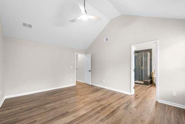 unfurnished room with wood-type flooring, vaulted ceiling, and ceiling fan