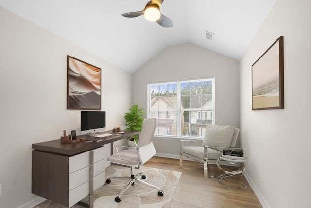 office space with light hardwood / wood-style flooring, vaulted ceiling, and ceiling fan