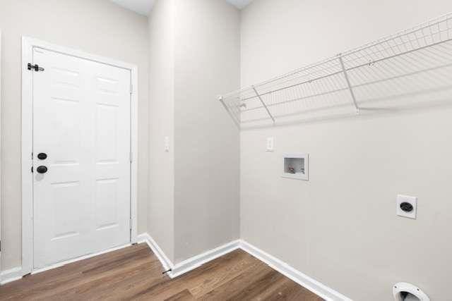 clothes washing area featuring hookup for an electric dryer, dark hardwood / wood-style floors, and hookup for a washing machine