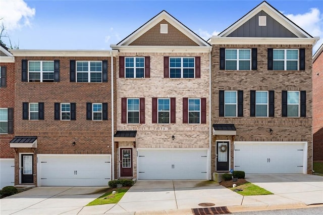 2227 Foley Park St, Snellville, GA 30078 - townhome / multi-family property with an attached garage, driveway, and brick siding