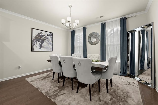 2227 Foley Park St, Snellville, GA 30078 - dining room featuring crown molding, a chandelier, and wood finished floors