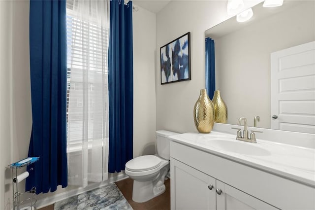 2227 Foley Park St, Snellville, GA 30078 - bathroom with vanity, shower / bath combo with shower curtain, and wood finished floors