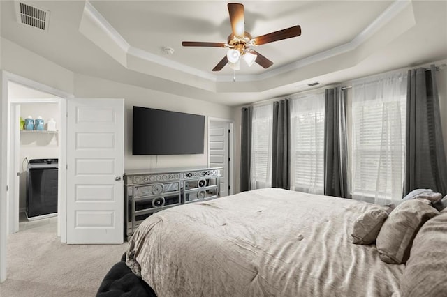2227 Foley Park St, Snellville, GA 30078 - bedroom featuring a tray ceiling, light carpet, washer / clothes dryer, crown molding, and ceiling fan