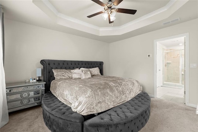 2227 Foley Park St, Snellville, GA 30078 - bedroom featuring carpet floors, a tray ceiling, a ceiling fan, and connected bathroom