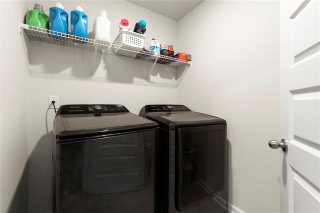 2227 Foley Park St, Snellville, GA 30078 - laundry room featuring washing machine and dryer and baseboards