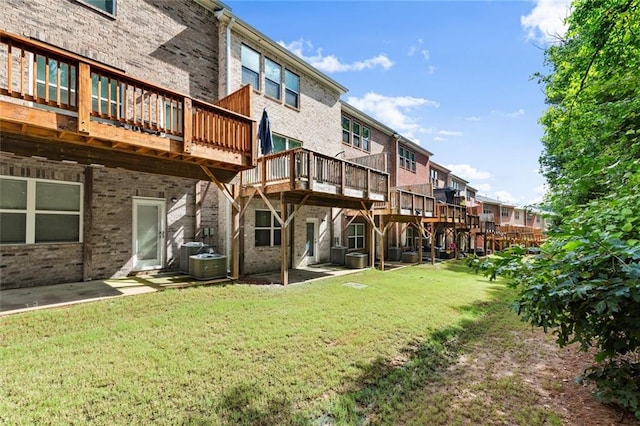 2227 Foley Park St, Snellville, GA 30078 - back of property featuring a yard, brick siding, a deck, and a residential view