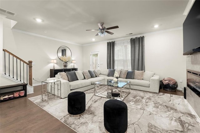 2227 Foley Park St, Snellville, GA 30078 - living room with crown molding, a ceiling fan, stairway, wood finished floors, and recessed lighting