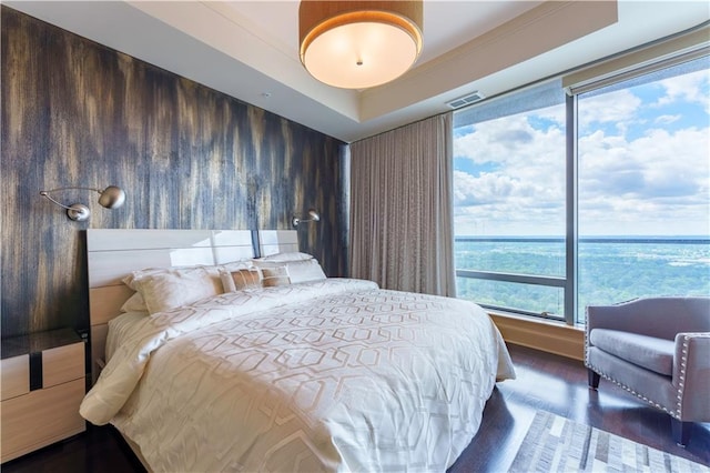 bedroom with wood finished floors