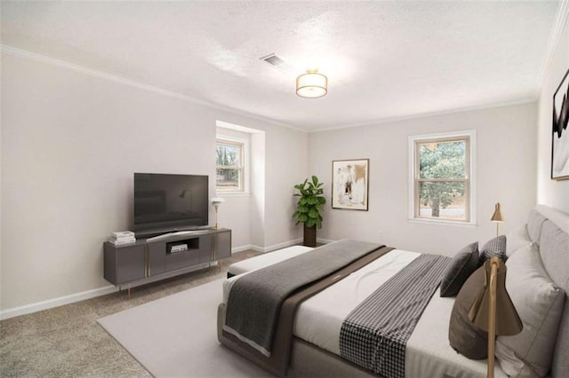 bedroom with crown molding and carpet floors