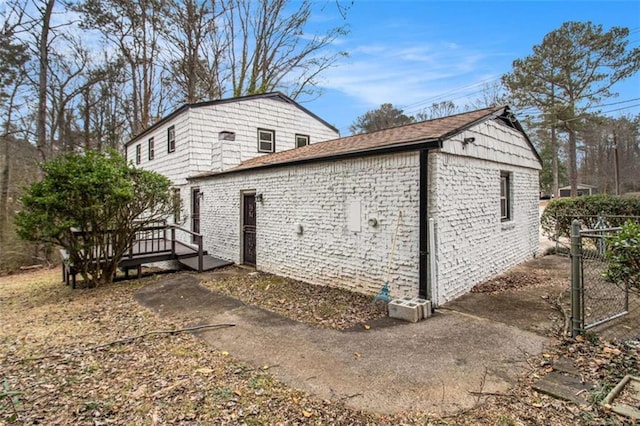 view of side of home featuring a deck