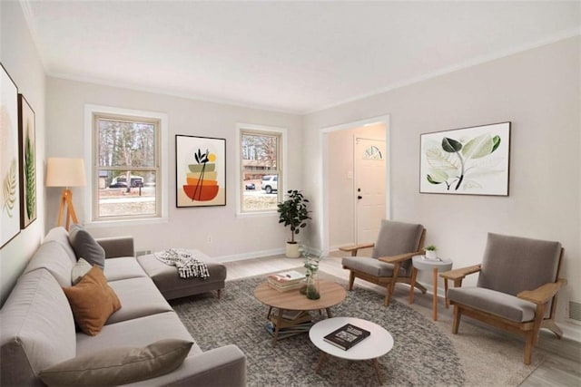 living room featuring crown molding, plenty of natural light, and wood-type flooring