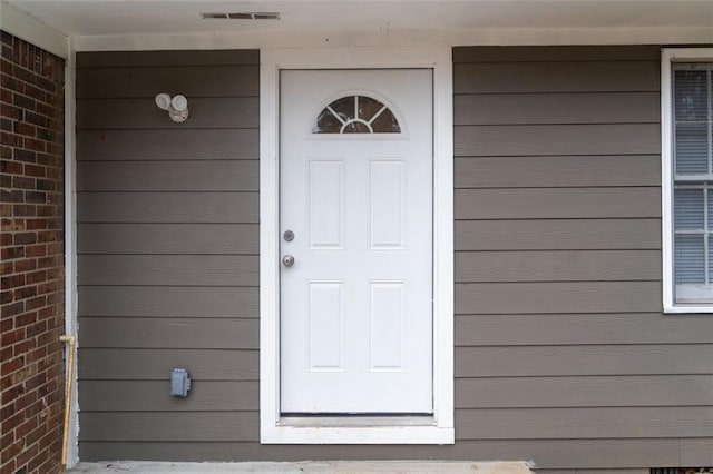 doorway to property with visible vents