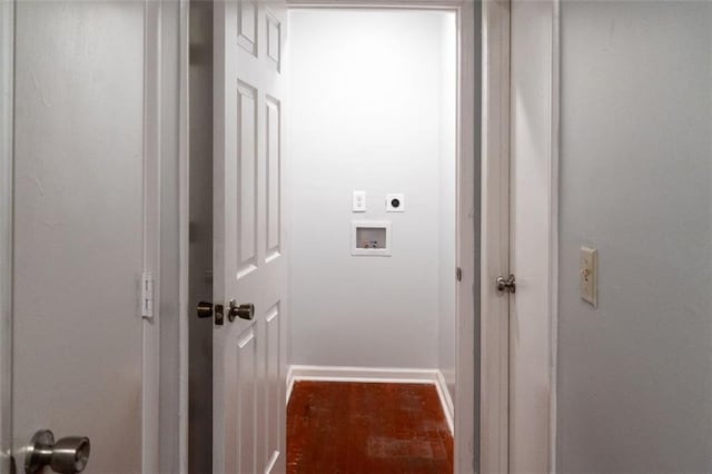 corridor with wood finished floors and baseboards