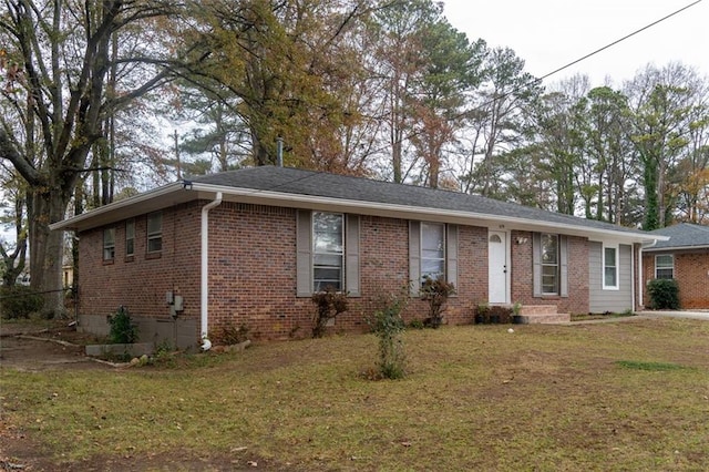 single story home featuring brick siding and a front lawn