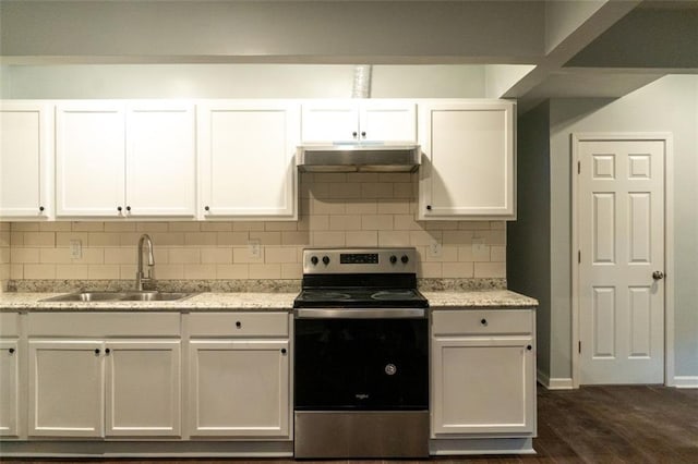 kitchen featuring stainless steel electric range, a sink, under cabinet range hood, white cabinetry, and tasteful backsplash