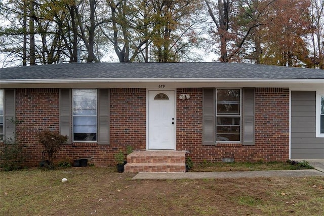 view of front of home featuring brick siding