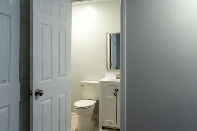 bathroom with toilet and vanity