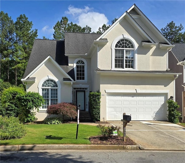 3773 Summer Rose Dr, Atlanta, GA 30341 - traditional home with stucco siding, a front yard, concrete driveway, and an attached garage
